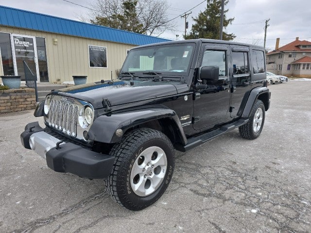 Used 2014 Jeep Wrangler Unlimited Sahara with VIN 1C4BJWEG8EL265883 for sale in Oregon, OH